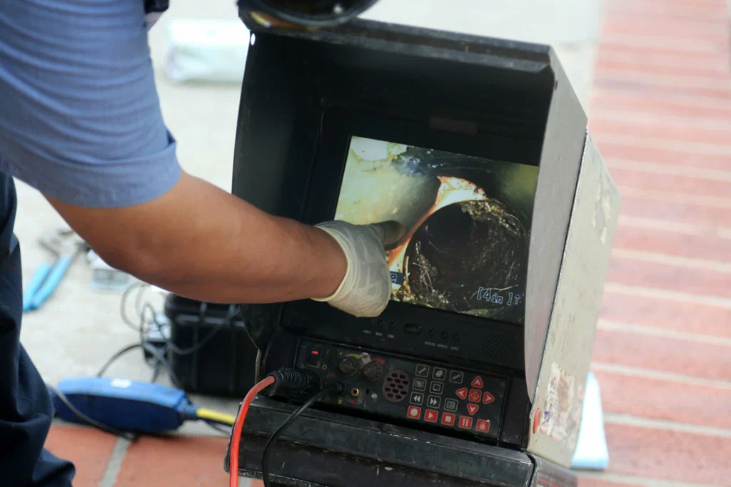 Technician viewing a drain inspection camera in San Ramon